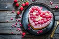 Heart shaped cake for Valentine\'s Day or mother\'s day on white wooden background Royalty Free Stock Photo