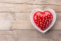 Heart shaped cake for Valentine`s Day or mother`s day on wooden table. Royalty Free Stock Photo