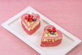 Heart-shaped cakes filled with cream and berries.