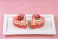 Heart-shaped cakes filled with cream and berries. Royalty Free Stock Photo