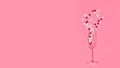 Heart shaped candies fall in the glass. Valentine's day candies fall in the champagne glass. Copy space Royalty Free Stock Photo