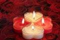 Heart shaped candle burning red and White Royalty Free Stock Photo