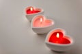 Heart shaped candles burning on valentines day