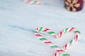 Heart shaped Candy canes blue background, close up