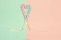 Heart shaped candy canes. Vintage pastel colored minimal concept Royalty Free Stock Photo
