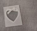 Heart shaped canvas frame on grey canvas