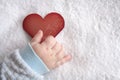 Heart shaped card in baby hand Royalty Free Stock Photo