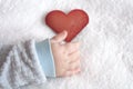 Heart shaped card in baby hand Royalty Free Stock Photo