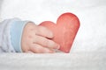 Heart shaped card in baby hand Royalty Free Stock Photo