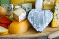 Heart shaped cheese on old boards colorful food abstract Royalty Free Stock Photo