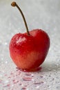 Heart shaped cherry with drops of water Royalty Free Stock Photo