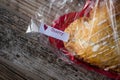Heart-shaped cherry hand-pie wrapped in cellophane Royalty Free Stock Photo