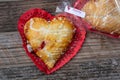 Heart-shaped cherry hand-pie wrapped in cellophane Royalty Free Stock Photo