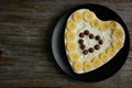 Heart shaped chocolate cake with banana slice Royalty Free Stock Photo