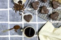 heart shaped chocolate cookies with coffee beans, powder and cup . Royalty Free Stock Photo
