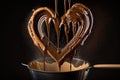 heart-shaped churros being dunked in warm chocolate sauce Royalty Free Stock Photo