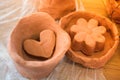 Heart shaped clay object in view