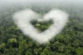 Heart shaped cloud captured in midst of serene forest. Perfect for expressing love and nature's Royalty Free Stock Photo
