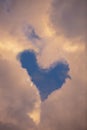 Heart shaped clouds in the blue sky.