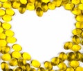 Heart shaped of cod liver oil isolated on white background with copy space. Source of Omega-3 DHA+EPA and vitamin A & D helps gr Royalty Free Stock Photo