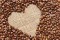 Heart-shaped coffee beans aslant soft light