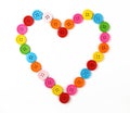 Heart shaped of colorful sewing buttons on white Royalty Free Stock Photo