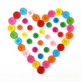 Heart shaped of colorful sewing buttons on white Royalty Free Stock Photo