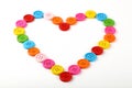 Heart shaped of colorful sewing buttons on white Royalty Free Stock Photo