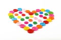 Heart shaped of colorful sewing buttons on white Royalty Free Stock Photo