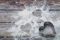 Heart shaped cookie cutter on the kitchen table and flour. Valentine`s Day concept Royalty Free Stock Photo