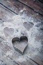 Heart shaped cookie cutter on the kitchen table and flour. Valentine`s Day concept. Vertical Image Royalty Free Stock Photo