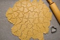 Heart shaped cookie cutters cutting out holiday. Cutting out heart shaped cookies from dough Royalty Free Stock Photo