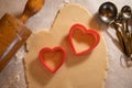 Heart Shaped Cookie Cutters with Cookie Dough and Baking Items Royalty Free Stock Photo