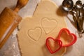 Heart Shaped Cookie Cutters with Cookie Dough and Baking Items Royalty Free Stock Photo