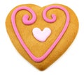 Heart shaped cookie with a pink frosting decoratio