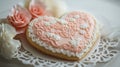 Heart Shaped Cookie with Pink Icing and Sugar Roses on White Background