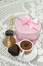 Heart shaped cookie with red gift box with bow and cup of coffee Royalty Free Stock Photo