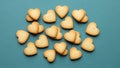 Heart-shaped cookies on blue background Royalty Free Stock Photo