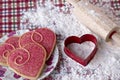 Heart shaped cookies and cutter Royalty Free Stock Photo