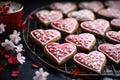 heart-shaped cookies decorated with icing on a baking tray Royalty Free Stock Photo