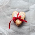 Heart-shaped cookies tied with a red ribbon