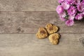 Heart shaped cookies. Top view of homemade cookies. Healthy dessert with cinnamon, dates and walnuts. Rustic background