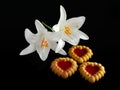 Heart-shaped cookies and Two white lilies Royalty Free Stock Photo