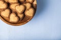 Heart-shaped cookies on a wooden dish