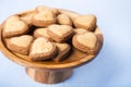 Heart-shaped cookies on a wooden dish