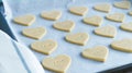 Heart shaped cookies with the word LOVE ready to bake. Pastry Concept Royalty Free Stock Photo