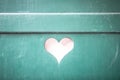 heart shaped cutout in a turquoise shutter Royalty Free Stock Photo