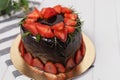 Heart shaped of delicious chocolate cake with strawberries Royalty Free Stock Photo