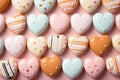 Heart shaped delicious glazed cookies, pink pastel background, top view.