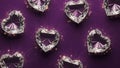 Heart-shaped diamonds on purple background Royalty Free Stock Photo